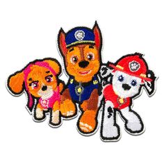 three embroidered patches with dogs on them, one is wearing a hat and the other has a