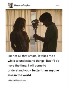 a man is giving flowers to a woman in front of a window with the caption, i'm not all that smart it takes me