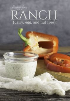 a jar of ranch dressing next to sliced tomatoes on a cutting board with the words, dairy, egg, and nut free