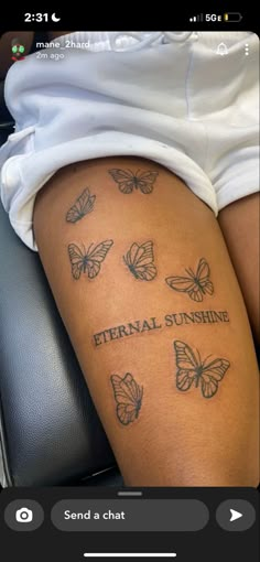 tattoo reading “eternal sunshine” with 7 butterflies Tattoo On Your Thigh, Middle Leg Tattoo, Thigh Tats For Women Baddie, Cool Thigh Tats For Women, Cute Tattoos For Black Women On Leg, Above The Knee Tattoos Black Women, Tattoo Ideas Female Meaningful Leg, Word Tattoos For Women On Thigh, Tattoo Behind Thigh Women