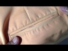 someone is stitching the zipper on a jacket