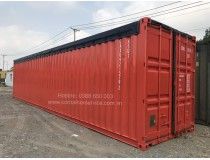 a large red shipping container sitting on top of a parking lot