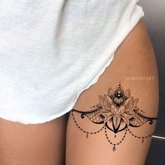 a woman's thigh with a tattoo on it