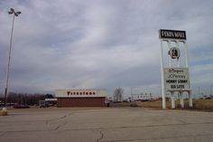 an empty parking lot in front of a fire station