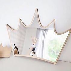 a mirror that is on the side of a wall