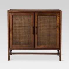 the sideboard is made from wood and has two doors with woven panels on top