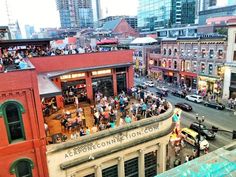 an aerial view of a city street with lots of people