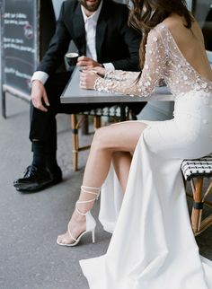 a man and woman sitting at a table