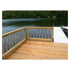 a wooden dock with a boat in the water