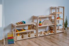 a child's play room with wooden shelves and toys