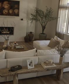 a living room filled with furniture and a fire place