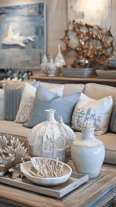 a living room filled with lots of furniture and decor on top of a wooden table