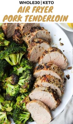 a white plate topped with meat and broccoli