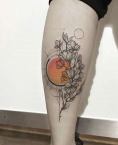 a woman's leg with flowers on it and an orange circle in the background