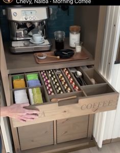 someone is holding their coffee drawer open