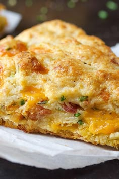 an omelet sitting on top of a piece of paper next to another item