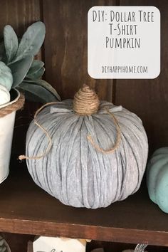 diy dollar tree t - shirt pumpkin sitting on a shelf