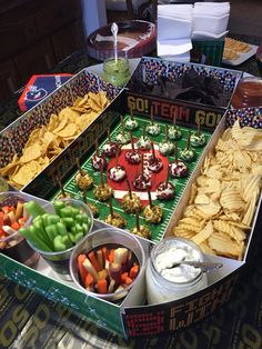 a football party food spread with snacks and dips