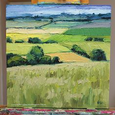 an oil painting of green and yellow fields