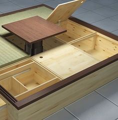 an open drawer on top of a wooden table