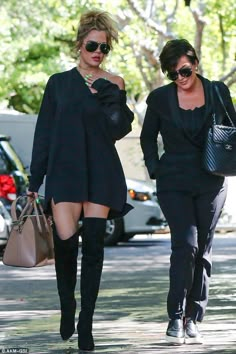 two women walking down the street together