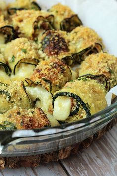 a casserole dish with zucchini and cheese