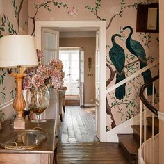 the hallway is decorated with birds and flowers