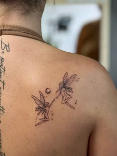 a woman with a tattoo on her back