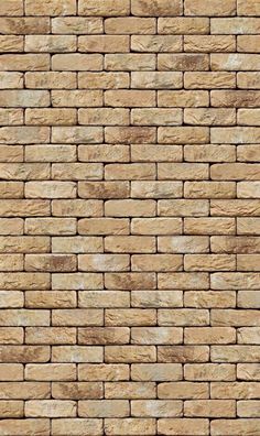 a brown brick wall textured with natural stone