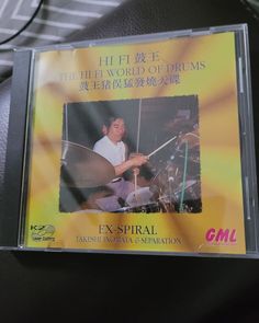 the cd cover shows an image of a man playing drums