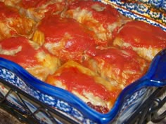 a casserole dish filled with meat and sauce