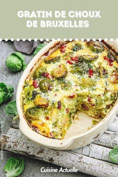 a casserole dish with broccoli and cheese in it on a table