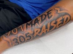 a man with a tattoo on his arm that reads,'made 350 raised '