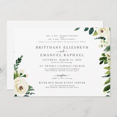 an elegant wedding card with white flowers and greenery