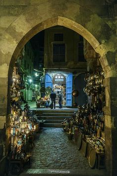 an archway leading to a store filled with lots of items