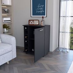 a living room with a couch, chair and bookcase