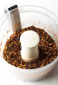 a food processor filled with lots of brown stuff