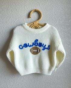 NFL football sweaters are here! If you're as big of a football fan as I am, then you need to grab one of these custom hand embroidered NFL team football sweaters for your little!  Don't see your team? Don't see your team colors? Don't see your size? Please send me a message and I would love to create a mock up or make a custom order for you! Although we are Minnesota Vikings fans, we are unbiased when it comes to making the most adorable outfits for your baby's and toddlers.  These sweaters have Football Sweaters, Football Sweater, Adorable Outfits, Toddler Sweater, Football Baby, Football Kids, Baby And Toddler, Minnesota Vikings, Diy Embroidery