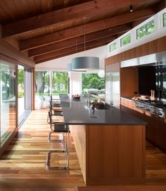 a kitchen with wooden floors and an island