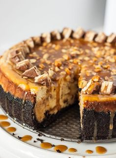 a cheesecake with peanut butter and chocolate toppings