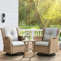 two chairs and a table on a porch