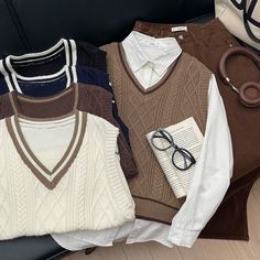 Indulge your librarian vibes with these stunning 5-color cable knit sweater vests, complete with a contrasting stripe collar to add a touch of personality. A must-have for any dark academia enthusiast - these vests are perfect for showing off your love for books, classic style, and intellectual pursuits. Measurements:Chest - 98cmLength - 54cm Light Academia Masc Outfit, Dark Academia Blue Outfits Men, Dark Academia Vest, Dark Academia Sweater, Cable Knit Sweater Vest, Books Classic, Sweater Vest Outfit, Dark Academia Outfit