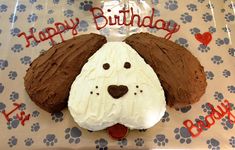 a birthday cake with a dog's face on it