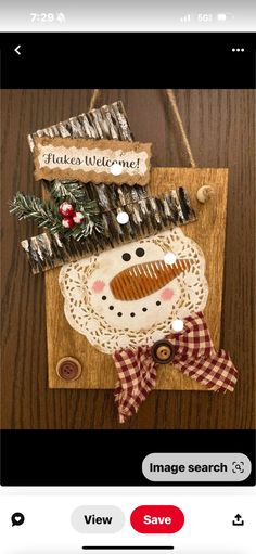 a wooden sign with a snowman on it