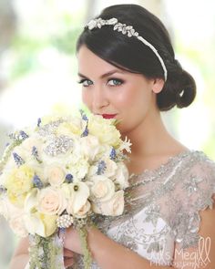 a beautiful woman holding a bouquet of flowers