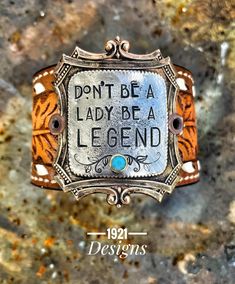 an old fashion bracelet that says, don't be a lady be a legend