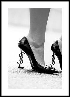 – Black and white photograph of a pair of heels with the YSL logo as the heel 				Gallery wall and picture wall inspiration - Desenio.com Prada Poster, Desenio Posters, Ysl Heels, Black And White Canvas, Black And White Prints, White Heels, Fashion Poster, Black High Heels, Black And White Photographs