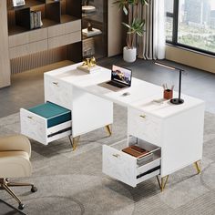 an office desk with two drawers and a laptop on it