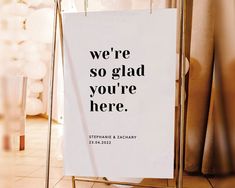 a sign that says we're so glad you're here