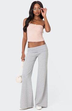 These Edikted Wide Leg Fold-Over Pants are the perfect choice for those days you want to feel comfortable while still looking put together. Rock it with a cardigan for the coolest y2k vibes. PantsFold over waistbandWide leg fitCotton, SpandexModel wears size SModel height is 5'9Item care: Machine wash at maximum 30C, do not bleach, tumble dry low, iron at a maximum of 110C, do not dry clean. Edikted Womens Wide Leg Fold Over Pants - Gray size Medium Fold Over Pants, Looking Put Together, Visionary Fashion, Y2k Vibes, Fame Dr, Skirted Swimwear, Bottom Clothes, Short Rompers, Basic Tees